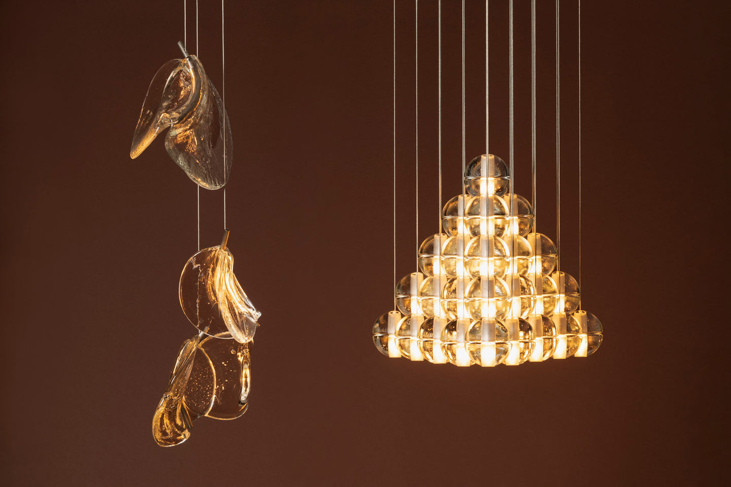 The new Bocci 141 made using a single-action pouring technique, and the expansion of the Bocci 14 pendant now re-imagined in a pyramid configuration. Photo c/o Bocci.
