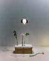 The Ingo Maurer Shhh! light featuring a light bulb that hovers ‘within the protective embrace of a headphone. Photo c/o Ingo Maurer.
