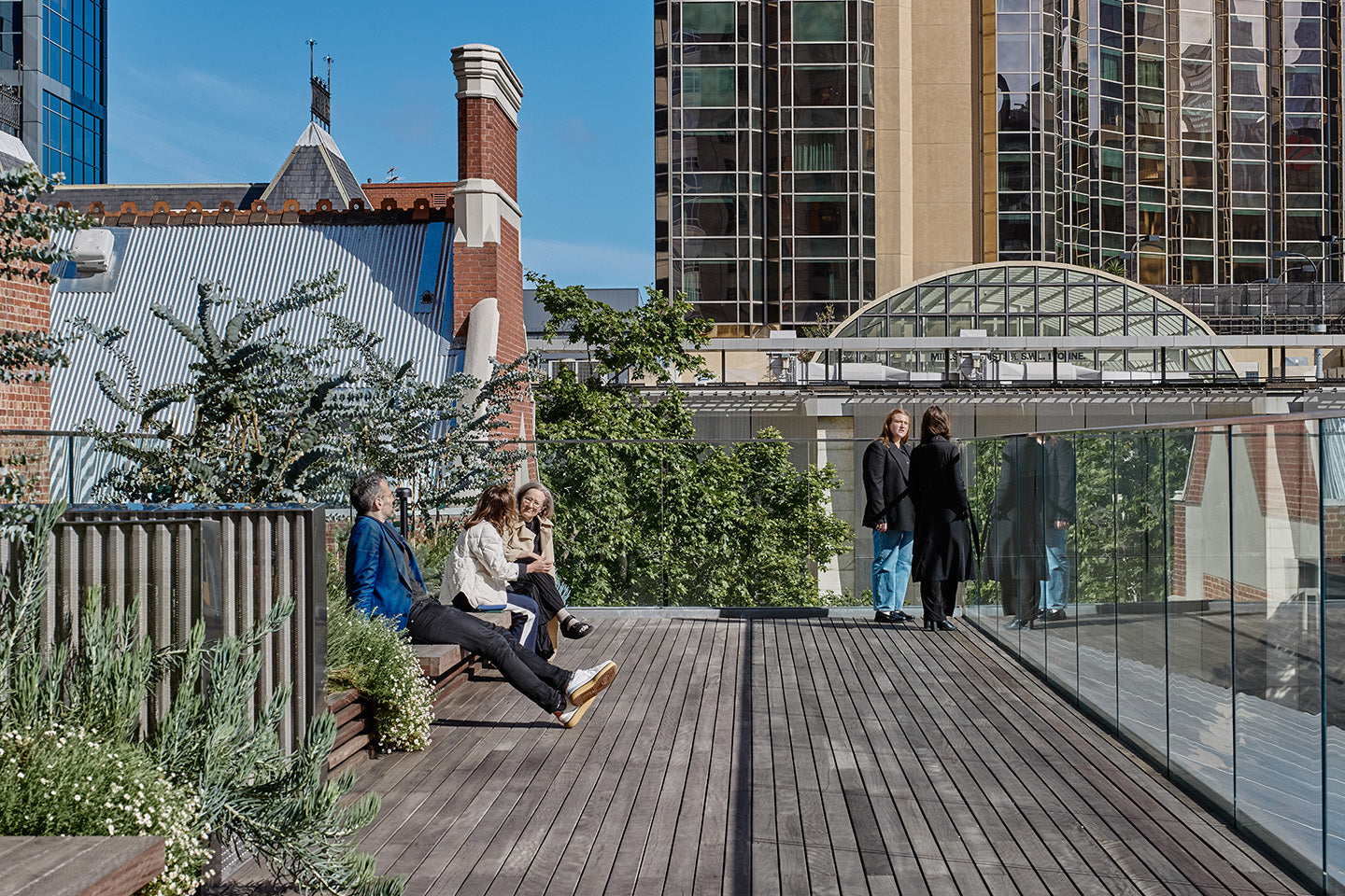 The rooftop's urban garden provides areas to meet and take a breather amongst nature in the middle of the city. Photography © Peter Bennetts c/o Hassell.
