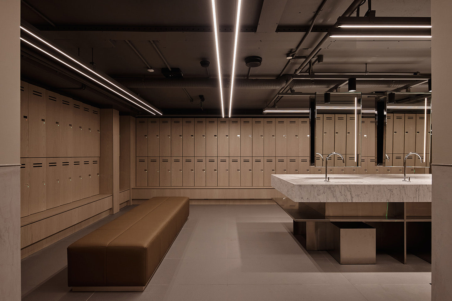 The cool and calm end-of-trip facility is beautifully detailed and supremely kitted out. Photography © Peter Bennetts c/o Hassell.
