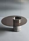Haumea Anniversary coffee table by Massimo Castagna, with special bronzed glass and natural brushed Travertino Silver base that is not treated with resin. Photos c/o Gallotti&Radice.
