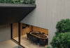 View from the top of the spiral stair down to the games room that opens to the landscaped courtyard below.
