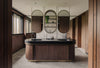 The Junior Master Suite bathroom is layered in warm timbers.
