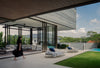 The interior becomes part of the garden and pool area, with furniture that is modular  and can be used outdoors, including the B&B Italia Outdoor Borea Oval Sunbed and Spool side table by Piero Lissoni, and the soft organic form of the Butterfly sofa by Patricia Urquiola.
