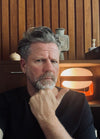 Tim Ross with his KD28 lamp designed by Joe Colombo in 1967. Photo c/o Tim Ross.
