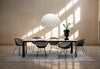 Kartell Big FL/Y suspension lamp, Four table, Smatrik chair. Calice vase and K-Lim rug.
